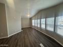 Spacious living room featuring luxury vinyl plank flooring and bright windows at 1143 S 96Th St, Mesa, AZ 85208