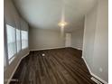 Spacious living room featuring luxury vinyl plank flooring and bright windows at 1143 S 96Th St, Mesa, AZ 85208
