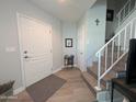 Bright entryway with laminate flooring and a staircase leading upstairs at 170 E Guadalupe Rd # 154, Gilbert, AZ 85234