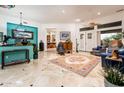 Spacious living room with tile floors, colorful walls, and high ceilings at 19644 N Majestic Vista Ct, Surprise, AZ 85387