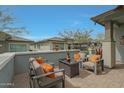 Relaxing patio with stylish outdoor furniture and tranquil views, perfect for entertaining or enjoying the outdoors at 20721 W Fern Dr, Buckeye, AZ 85396