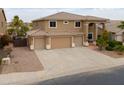 Stylish two-story home with spacious three-car garage and well-maintained desert landscaping at 22139 N O Sullivan Dr, Maricopa, AZ 85138