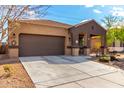 Well-maintained home featuring a two-car garage and neat landscaping at 23791 W Magnolia Dr, Buckeye, AZ 85326