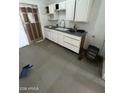 Kitchen featuring wooden cabinets and a sink, providing a solid foundation for renovation at 3241 W Fillmore St, Phoenix, AZ 85009