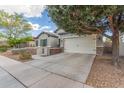 Wide driveway leads to a two-car garage, with mature trees in a well-maintained yard at 3439 E Shannon St, Gilbert, AZ 85295