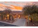 Charming desert home with mature trees, cacti, and inviting curb appeal at 4413 S Tigre Del Mar Dr, Gold Canyon, AZ 85118