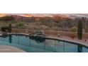 Refreshing pool featuring serene views of the desert landscape and distant mountains at 4413 S Tigre Del Mar Dr, Gold Canyon, AZ 85118