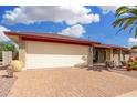 Spacious garage, brick accents, with a charming paved brick driveway at 4838 E Calypso Ave, Mesa, AZ 85206