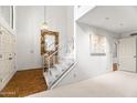 Bright foyer featuring high ceilings, a staircase, and neutral walls, perfect for showcasing art at 6340 N 34Th Pl, Paradise Valley, AZ 85253