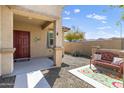 Inviting front porch with a vibrant rug and comfortable bench seating at 8445 N 61St Ln, Glendale, AZ 85302