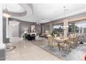 Elegant living and dining room with neutral colors, high ceilings, and large windows at 8607 E Preserve Way, Scottsdale, AZ 85266