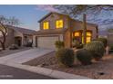 Charming two-story home featuring a two-car garage and desert landscaping on a corner lot at 10468 E Raintree Dr, Scottsdale, AZ 85255