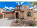 Charming two-story home with a neutral color palette, archway entry, and a well-maintained landscaped front yard at 12887 N 93Rd Dr, Peoria, AZ 85381