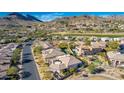 Aerial view of neighborhood with desert landscape, golf course and mountain views at 14808 E Miramonte Way, Fountain Hills, AZ 85268