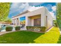 Manicured backyard, patio, and pool view from a modern home at 14808 E Miramonte Way, Fountain Hills, AZ 85268