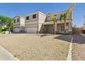 Charming two-story home featuring a two-car garage and drought-tolerant landscaping at 1677 E Heather Dr, San Tan Valley, AZ 85140