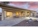 Spacious covered patio featuring a concrete floor and multiple seating areas, ideal for enjoying the serene outdoor space at 16927 W Desert Blossom Way, Surprise, AZ 85387