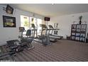 Exercise room with treadmills, bikes, weights, and entertainment at 18416 N Cave Creek Rd # 1053, Phoenix, AZ 85032
