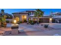 Beautiful home with manicured landscaping and a three-car garage at 1922 E Saltsage Dr, Phoenix, AZ 85048