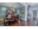 Elegant dining room featuring a chandelier, hardwood floors, and classic furnishings at 3432 E Jasper Dr, Gilbert, AZ 85296