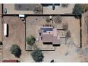 Aerial view of property with solar panels on the roof and a fully fenced yard in a desert landscape at 37509 N 7Th N St, Phoenix, AZ 85086