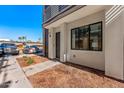 Contemporary facade displaying a welcoming entrance, sleek lines, and minimalist landscaping at 4220 N 32Nd St # 32, Phoenix, AZ 85018