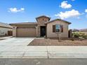 Inviting single-story home with a stone-accented entry and a well-maintained front yard at 4336 N 93Rd Dr, Phoenix, AZ 85037