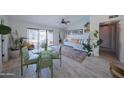 Bright living room with sliding glass doors to the pool, tile floors, and vaulted ceilings at 614 W Morrow Dr, Phoenix, AZ 85027