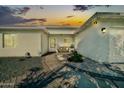 Charming home entrance with a walkway, bench, and well maintained landscaping at 6814 N 11Th St, Phoenix, AZ 85014