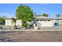 Charming single-story home featuring well-maintained landscaping and an attached two-car garage at 6814 N 11Th St, Phoenix, AZ 85014