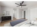 Bedroom featuring a ceiling fan, modern decor, and access to a ensuite bathroom at 8541 N 112Th Ave, Peoria, AZ 85345