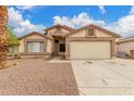 Charming single-story home with a well-maintained front yard, desert landscaping, and a spacious two-car garage at 8541 N 112Th Ave, Peoria, AZ 85345