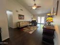 Cozy living room featuring vaulted ceilings, ceiling fan, and neutral color palette, creating an inviting atmosphere at 1002 E Grandview Rd, Phoenix, AZ 85022
