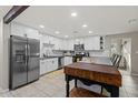 Bright kitchen with white cabinetry, stainless steel appliances, subway tile backsplash, and large butcher block island at 13614 N 38Th Pl, Phoenix, AZ 85032