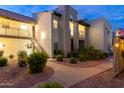 Inviting condo building exterior with well-maintained landscaping and staircase access at 14145 N 92Nd St # 2077, Scottsdale, AZ 85260