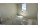 Bright bedroom features a window with lots of natural light and neutral walls at 22824 E Roundup Way, Queen Creek, AZ 85142