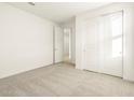 Cozy bedroom featuring carpet, closet, and a door leading to another room at 4332 W Hannah St, San Tan Valley, AZ 85144