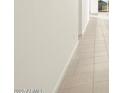 Bright hallway with neutral tile flooring, leading to other areas of the house at 4332 W Hannah St, San Tan Valley, AZ 85144