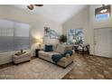 Bright living room with comfortable seating, natural light, and tasteful decor, ideal for relaxation at 45583 W Sheridan W Rd, Maricopa, AZ 85139