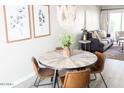 Inviting dining area featuring a round table, stylish chairs, and a modern chandelier at 4600 N 68Th St # 368, Scottsdale, AZ 85251