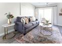 Bright living room boasts a stylish sofa, modern decor, and a large window for natural light at 4600 N 68Th St # 368, Scottsdale, AZ 85251