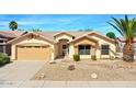 Charming single-story home showcasing a two-car garage, desert landscaping, and a welcoming facade at 604 W Villa Rita Dr, Phoenix, AZ 85023
