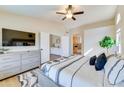 Bright main bedroom with ensuite bath, featuring neutral tones, large windows, and plush carpeting at 832 N Blue Marlin Dr, Gilbert, AZ 85234