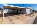 Well-maintained single-story home with carport offers comfortable and convenient living at 10951 N 91St Ave # 250, Peoria, AZ 85345