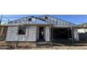 Exterior view of a home under construction, featuring scaffolding and thermal insulation at 15784 W Beryl Ave, Waddell, AZ 85355