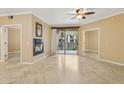 Bright living room with fireplace, ceiling fan, and sliding doors to a balcony at 1701 E Colter St # 311, Phoenix, AZ 85016