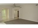 Inviting living room featuring tile floors, neutral walls, and an arched doorway at 20479 N 105Th Ave, Peoria, AZ 85382
