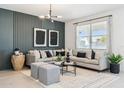 Beautiful living room with a decorative wall, stylish furniture, and plenty of natural light at 23984 W Cocopah St, Buckeye, AZ 85326