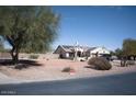 Single-story house with desert landscaping and solar panels on a clear day at 3721 N Brindley Ave, Litchfield Park, AZ 85340