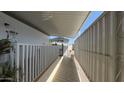 A walkway with a white fence, connecting different parts of the property at 4065 E University Dr # 471, Mesa, AZ 85205